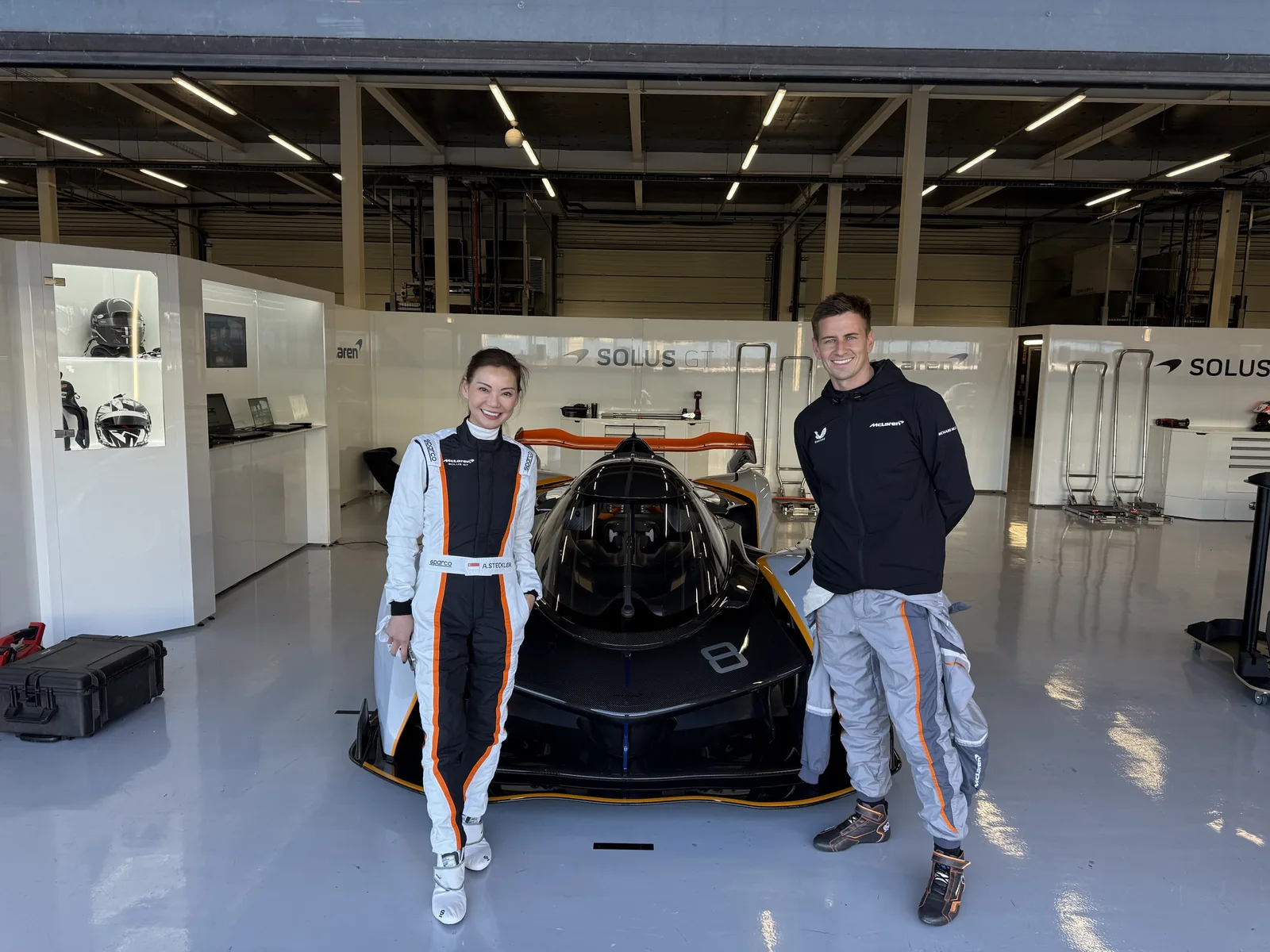 Jack Barlow coaching the owner of a McLaren Solus GT in the garage at Silverstone